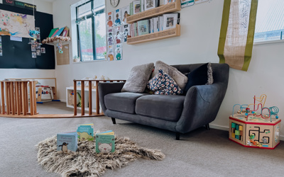 nursery room visual at Active Explorers in Rolleston showing the couch, toys and cozy space available for children under two years of age