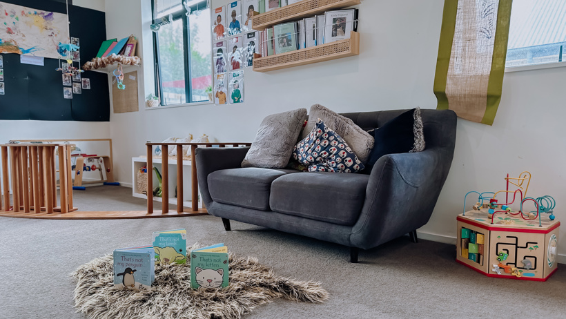 nursery room visual at Active Explorers in Rolleston showing the couch, toys and cozy space available for children under two years of age