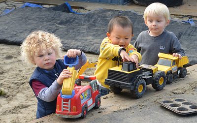 children at daycare playing in sandpit
