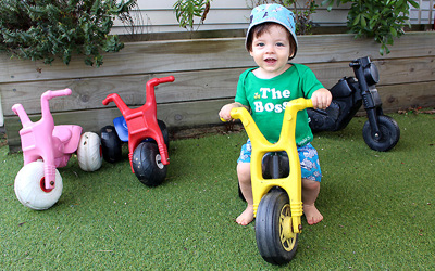 boy on trike at childcare