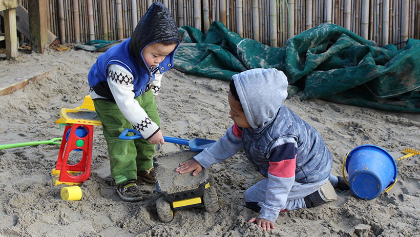 boys in sandpit at childcare