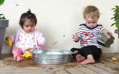 water play boy and girl at daycare