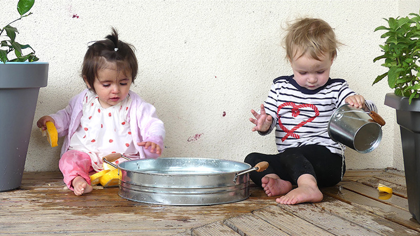 water play boy and girl at daycare