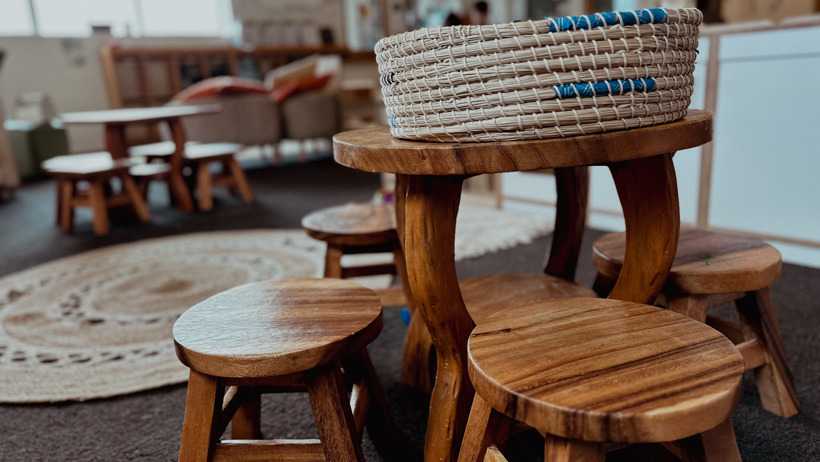 Wooden carved table and chair set for children at Active Explorers Grenada preschool in Wellington